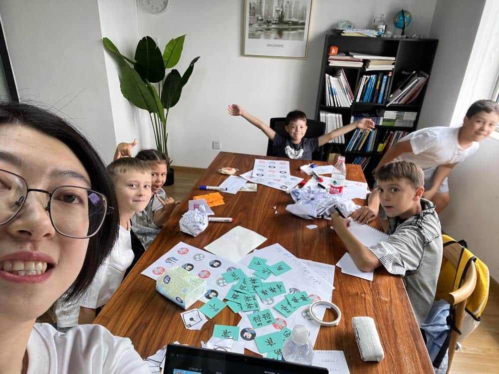 Teacher Anna engaging with a child during GoEast summer camp