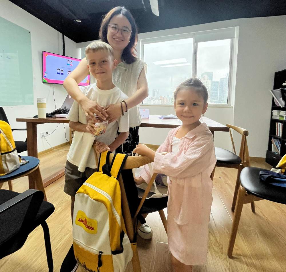 Teacher Qiaoqiao with a student